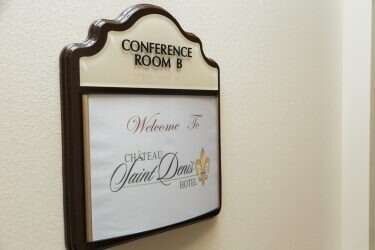 Conference room sign at Chateau Saint Denis Hotel.